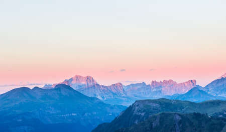 Mountain range around the Settsass, view from the Passo Pordoi in the dolomites at dawn.の写真素材