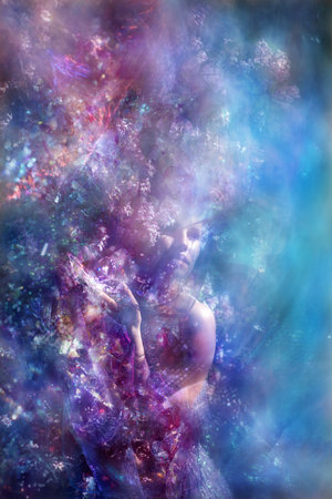 A young woman, dressed in a glittering dress is holding a crystaline butterfly at springtime.の写真素材