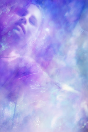 Dreaming woman  with soft, blurred spring blossoms and bokeh texturesの写真素材