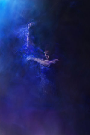 Strong and esthetic expression of an adult female with translucent veils on her armsの写真素材