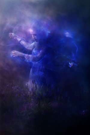 A shining spirit part of a mystically lit woman, standing for the subconscious is holding a glwoing...