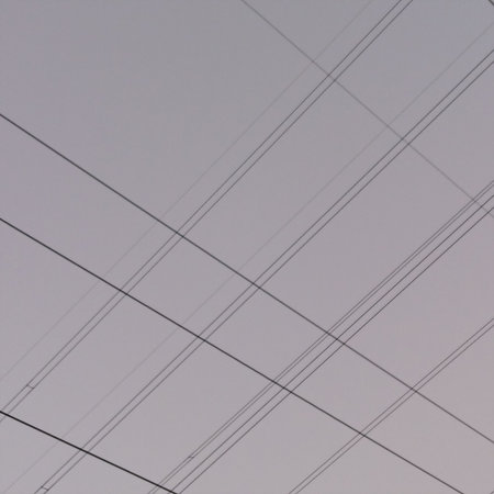 High-voltage lines in the sky, closeup of photoの写真素材