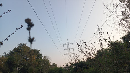 High-voltage power line on the background of the blue sky