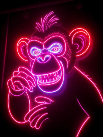 Neon illustration of a monkey on a dark background. Neon sign in the style of the 80s.の素材