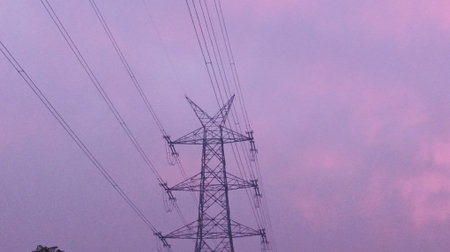 High voltage post. High-voltage tower sky background. Electricity distribution station.
