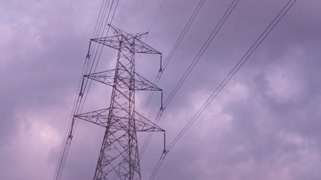 High voltage power lines. High-voltage tower sky background.