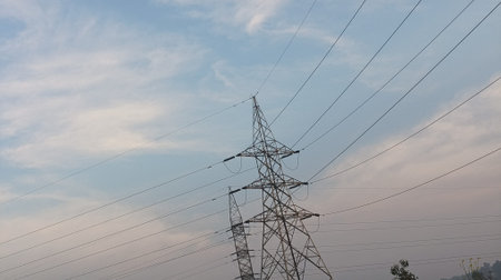 High voltage post. High-voltage tower on blue sky background.