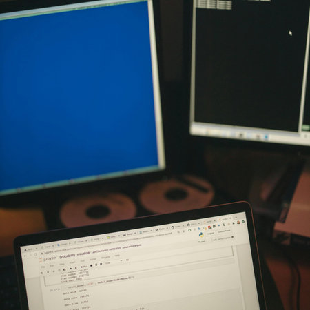 Close-up view of a laptop with a blue screen on the table