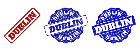 DUBLIN scratched stamp seals in red and blue colors. Vector DUBLIN imprints with dirty style. Graphic elements are rounded rectangles, rosettes, circles and text tags.のイラスト素材