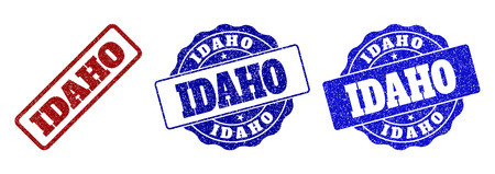 IDAHO grunge stamp seals in red and blue colors. Vector IDAHO labels with draft style. Graphic elements are rounded rectangles, rosettes, circles and text labels. Designed for rubber stamp imitations.のイラスト素材