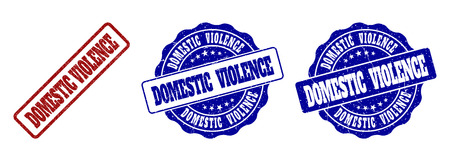 DOMESTIC VIOLENCE scratched stamp seals in red and blue colors. Vector DOMESTIC VIOLENCE overlays with draft surface. Graphic elements are rounded rectangles, rosettes, circles and text captions.のイラスト素材