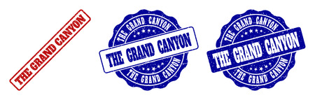 THE GRAND CANYON grunge stamp seals in red and blue colors. Vector THE GRAND CANYON watermarks with grunge surface. Graphic elements are rounded rectangles, rosettes, circles and text captions.のイラスト素材