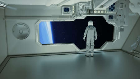 An astronaut on a spaceship watching the earthの写真素材