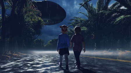 A little boy and girl at dusk walk along the wet highway, over which an alien UFO flies. For sci-fi, futuristic, sci-fi or interstellar backgrounds.の写真素材