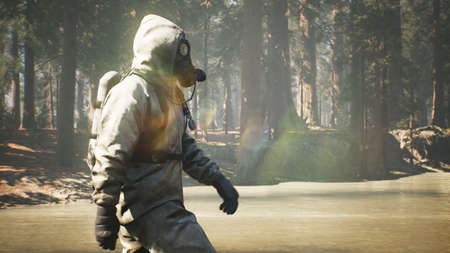 A Stalker in a chemical protection suit and a gas mask walks through a summer Sunny forest. The concept of a post-apocalyptic world after a pandemic. 3D Rendering.の写真素材
