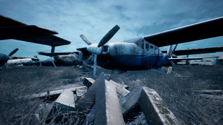 Rusty and broken planes stand in a field against a hazy blue sky. A lot of destroyed, destroyed,...