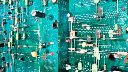 Technological background of the circuit board. Inside the electronic device are the components of the motherboard: microcircuits, transistors, LEDs, semiconductors. 3D Rendering.の写真素材