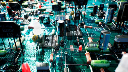 Electronic components inside a technological device: microchips, transistors, LEDs, and semiconductors. 3D Rendering.の写真素材