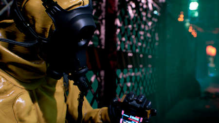 A nuclear physicist sits on a neon street and checks the surrounding radiation with a dosimeter. Post-apocalyptic world concept. 3D Rendering.の写真素材