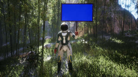 An astronaut stands with a blue screen banner, on a new uncharted planet. The concept of discovering...
