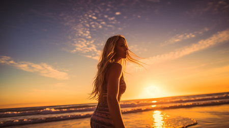 a woman standing on a beach.の素材