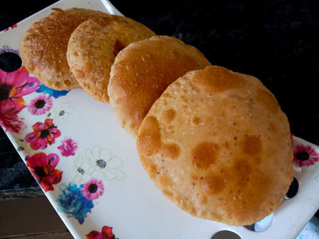Kachori or Puri, an Indian dish served with gravy recipe , which is made by frying in oil.