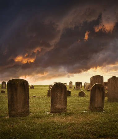 Spooky Halloween tombstones against stormy skyの写真素材