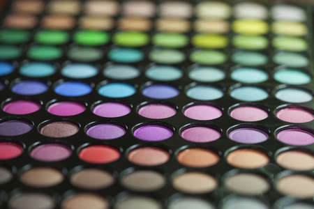 Low angle, selective focus view of a colorful eyeshadow paletteの写真素材