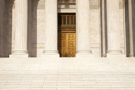 Front view of the steps, columns and doors of the Supreme Court of the United States in Washington, DCの写真素材
