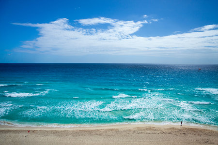 High angle view of the beach and sea at Cancun with a surf fisherman on a sunny day