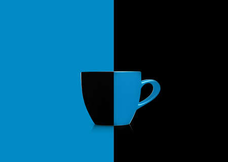 Two colors mug on blue and black background.の写真素材
