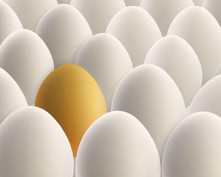 unique golden egg between white eggsの写真素材