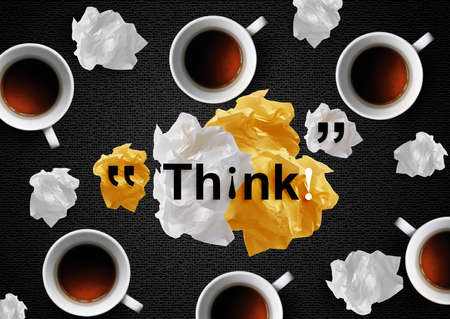 Crumpled colorful papers with coffee on black desktop.の写真素材