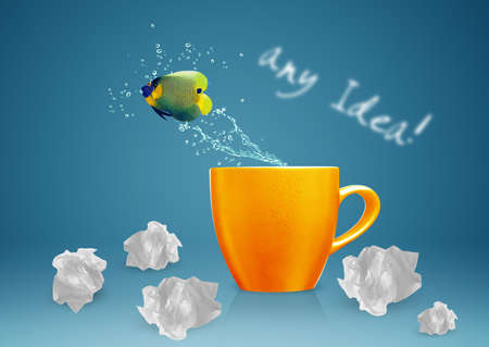 Angelfish jumping out of cup with water splashes and Acrobatic movement.の写真素材