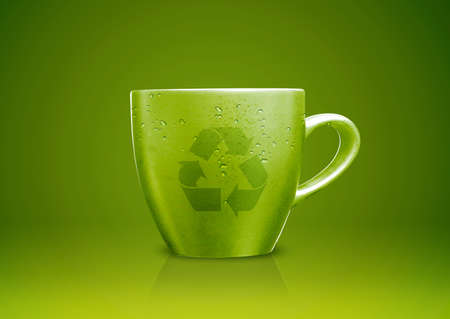 Green tea mug or cup with recycle sign on it, environmental conceptual image.の写真素材