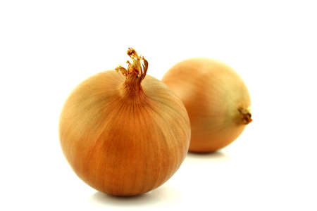 Ripe golden onions on white background.の写真素材