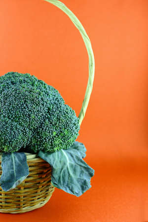 Fresh broccoli in Basket with leaves.の写真素材