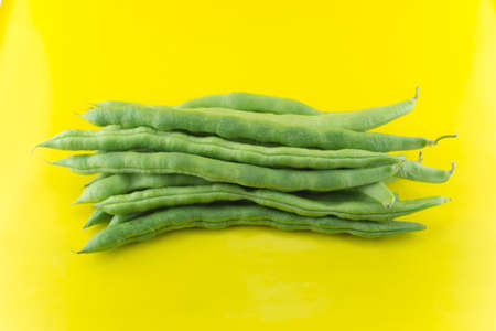 fresh beans fruit on yellow background .の写真素材