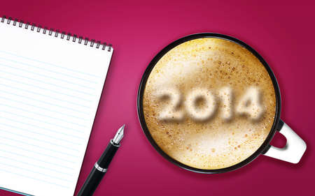 Happy new year 2014, cup of cappuccino with 2014 numbers made from foam with notepad and pen.の写真素材