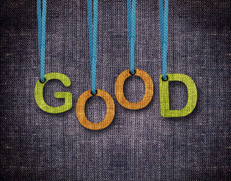Good Letters hanging strings with blue sackcloth background.の写真素材