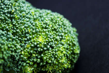Fresh broccoli on black background.の写真素材
