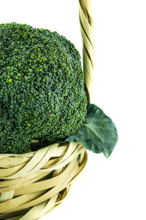 Fresh broccoli in Straw basket on white background.の写真素材