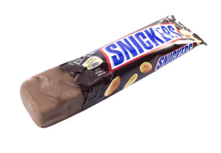 Amman, Jordan - December 5, 2014: Snickers chocolate bar isolated on white background. Snickers...