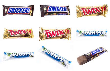 Amman, Jordan - December 5, 2014: Snickers, Bounty, Twix chocolate bar isolated on white background. Snickers, Bounty, Twix chocolate bar made by Mars, Incorporated.のeditorial素材
