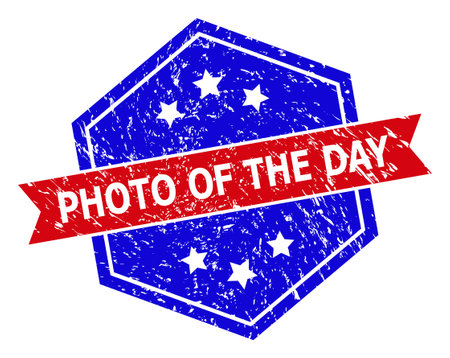 Hexagon PHOTO OF THE DAY watermark. Flat vector red and blue bicolor distress watermark with PHOTO OF THE DAY title inside hexagon form, ribbon is used. Rubber imitation with grunged surface,のイラスト素材