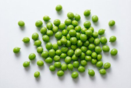 Green peas on white background. Top view. Healthy food concept.の素材