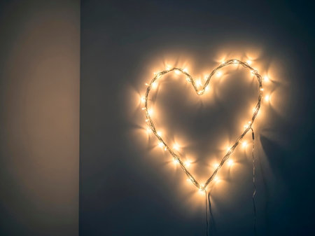 Valentine's day background with heart shaped lights on dark wallの素材