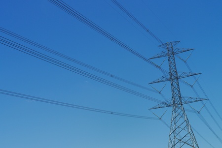 high voltage post with blue sky