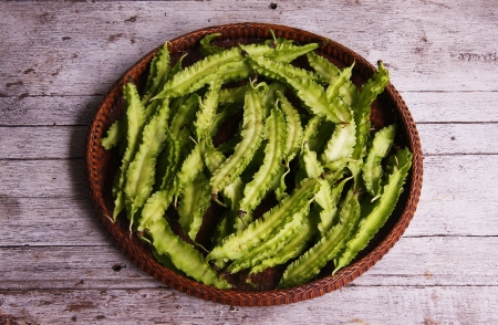Winged Bean in the threshing basket on wooden tableの写真素材