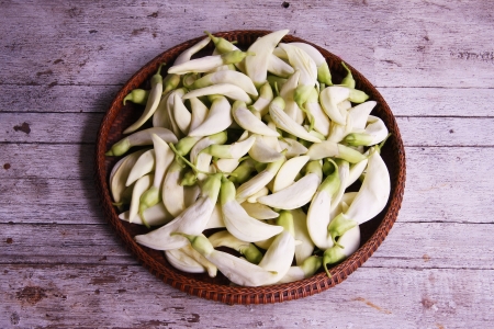 Vegetable Humming Bird Sesban Agasta    in the threshing basket on wooden tableの写真素材
